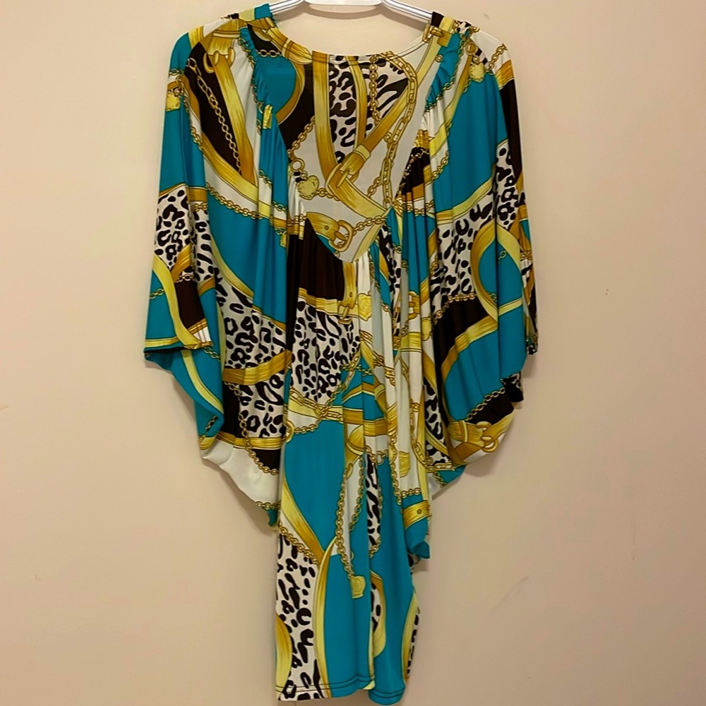 Belt and buckle pattern multi colored poncho style mini dress with half sleeves
